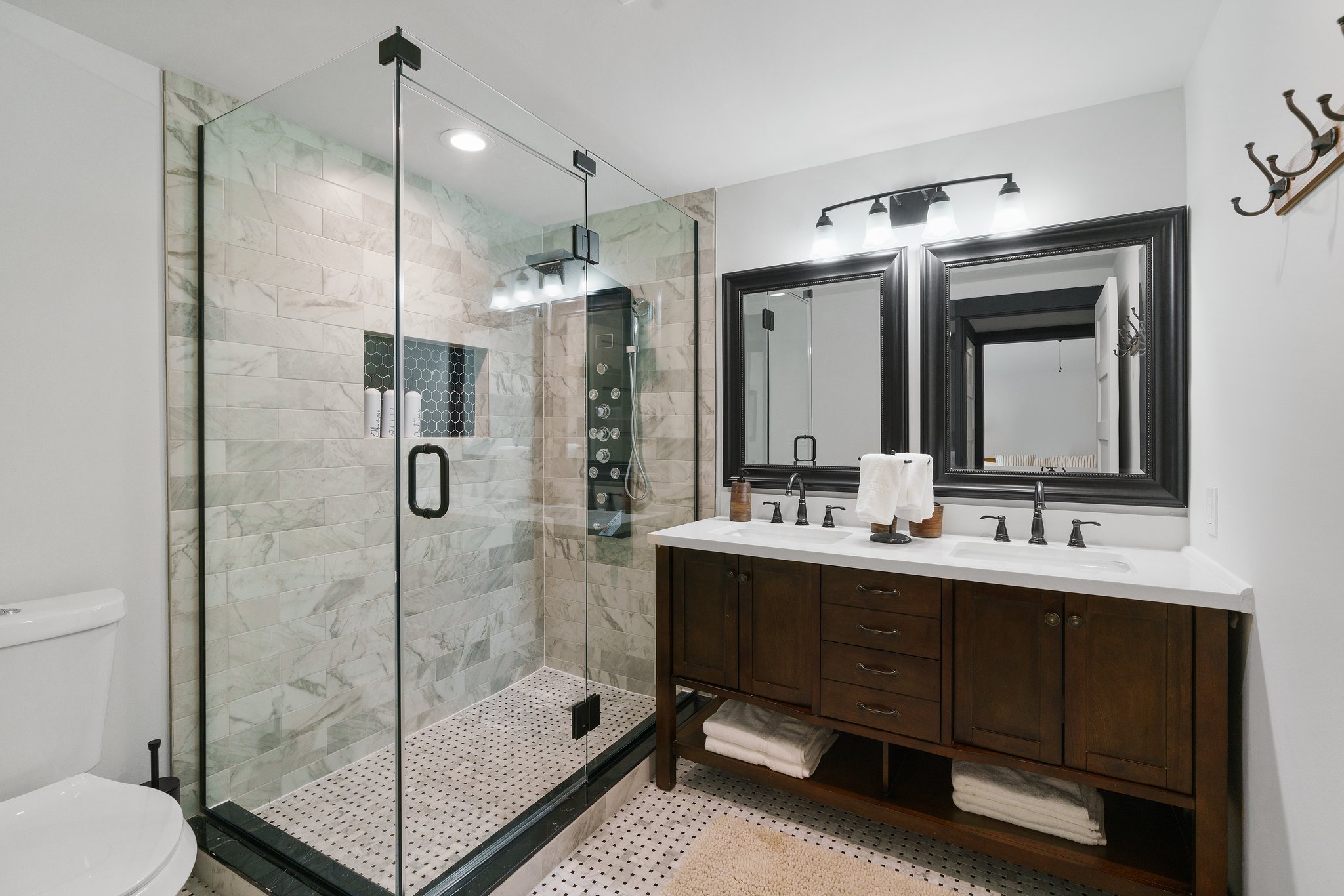 1204 East 13th Street Georgetown, TX 78626 - Photo 17 of 26 a bathroom with a double vanity sink mirror and shower