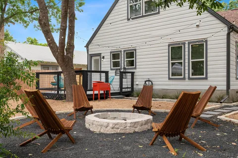 a view of a two chairs in the patio