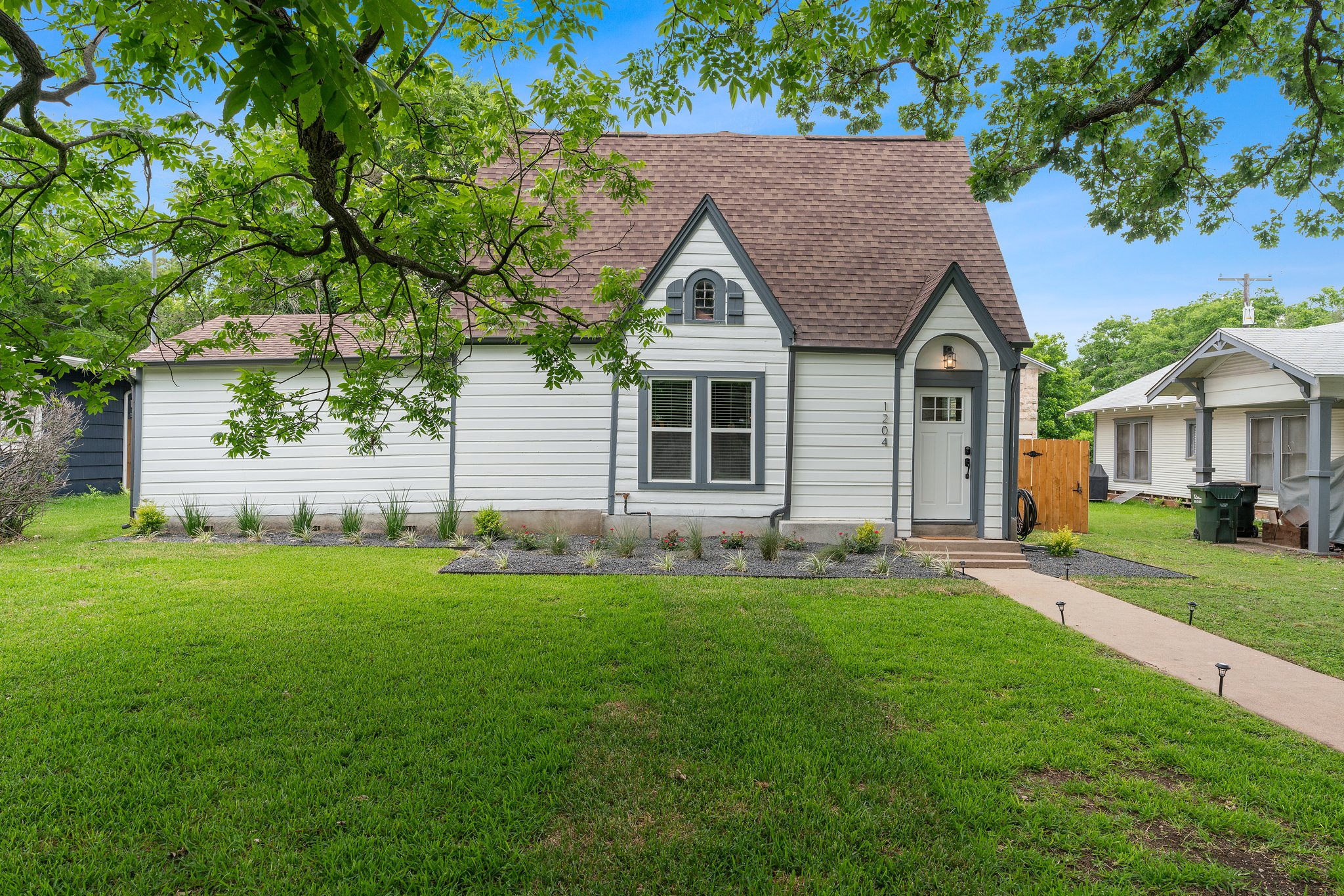 1204 East 13th Street Georgetown, TX 78626 - Photo 10 of 26 a front view of a house with a yard
