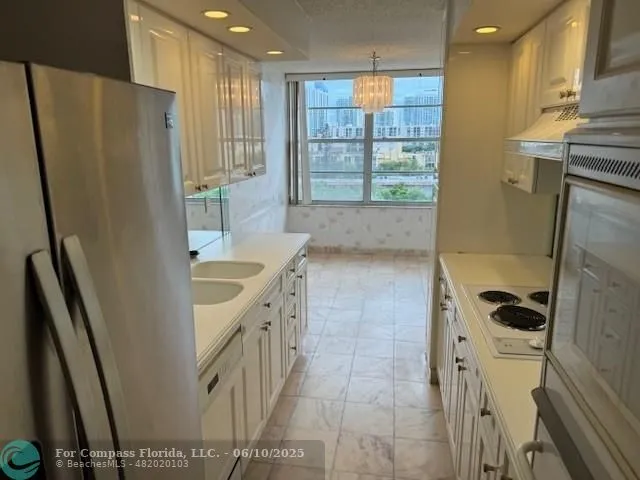 an empty room with wooden floor and closet