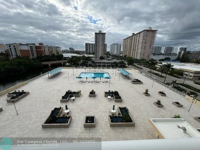 a view of a terrace with wooden benches