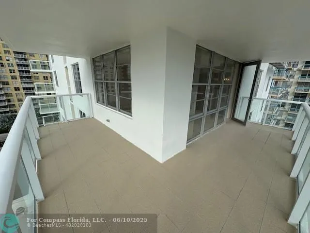 a kitchen with a refrigerator and a sink