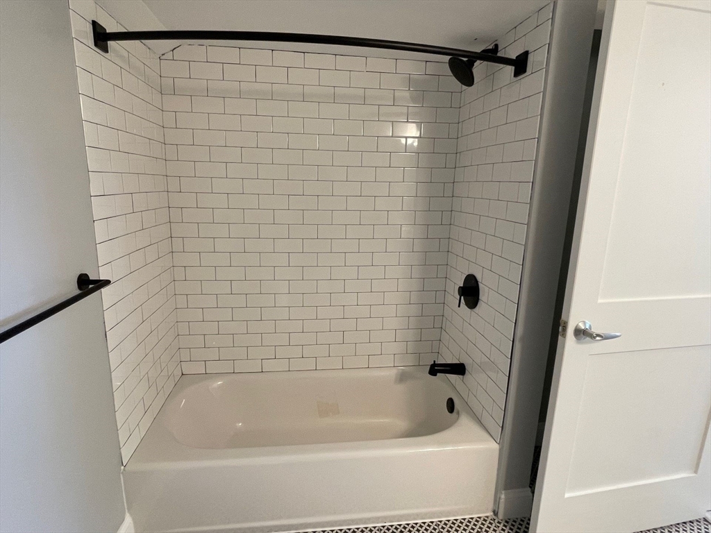 233 Lafayette Street, Unit 22 Salem, MA 01970 - Photo 5 of 7 a bathroom with a shower and a bath tub
