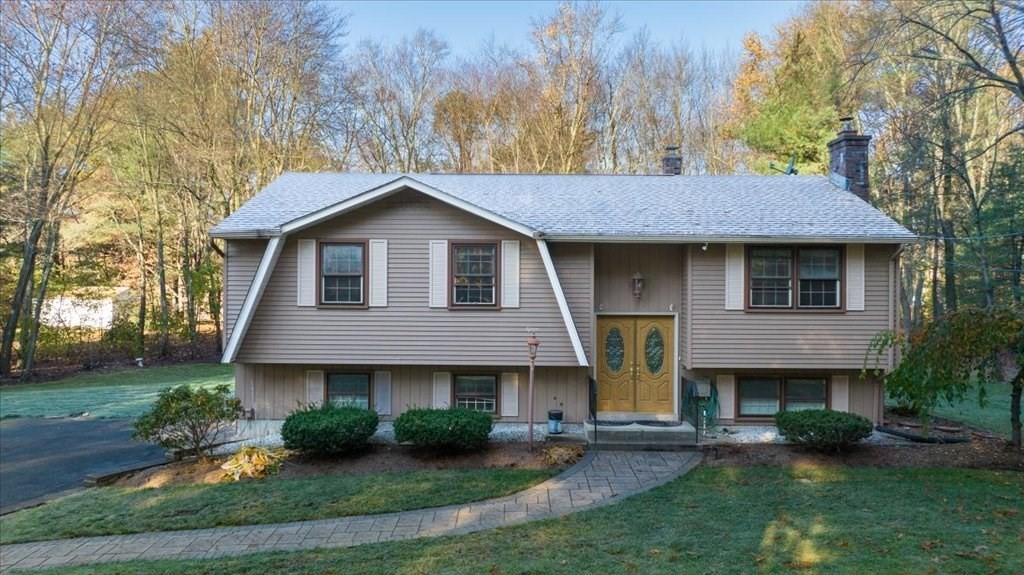 15 Wilbraham Road Hampden, MA 01036 - Photo 1 of 38 a front view of a house with garden