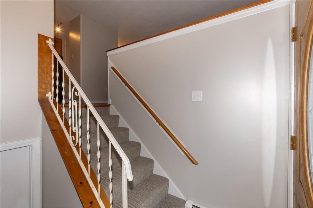 15 Wilbraham Road Hampden, MA 01036 - Photo 16 of 38 a view of staircase with lots of frames on wall and wooden floor