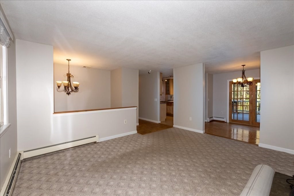 15 Wilbraham Road Hampden, MA 01036 - Photo 27 of 38 an empty room with windows and pillars in it