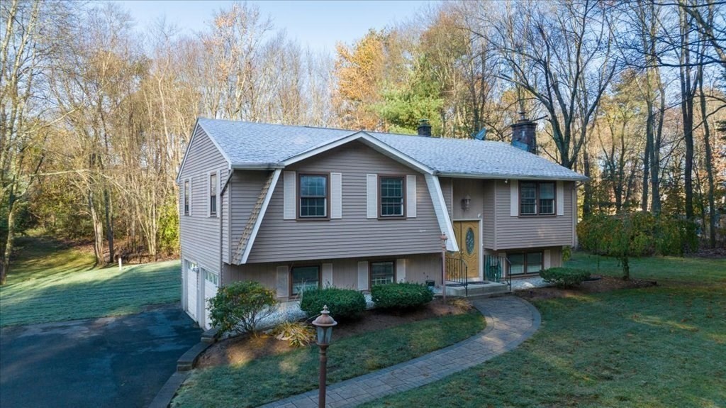 15 Wilbraham Road Hampden, MA 01036 - Photo 3 of 38 a front view of a house with garden