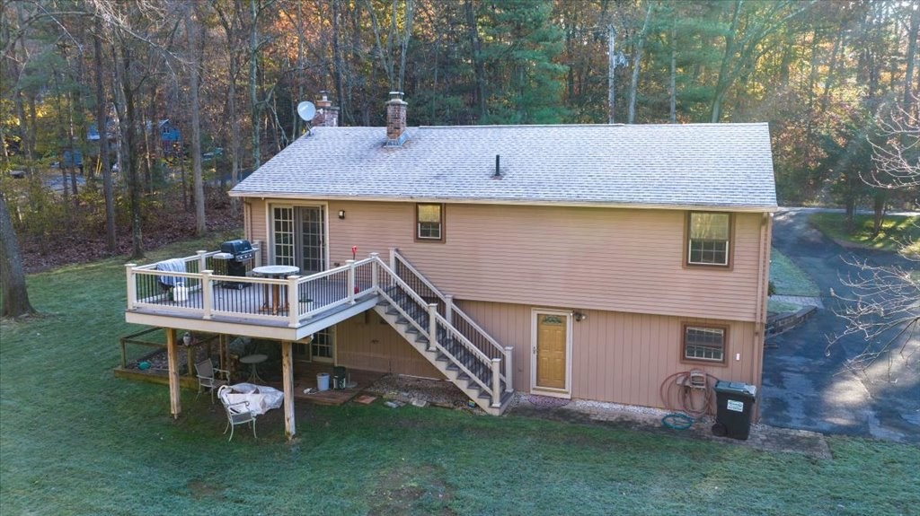 15 Wilbraham Road Hampden, MA 01036 - Photo 7 of 38 a backyard of a house with table and chairs