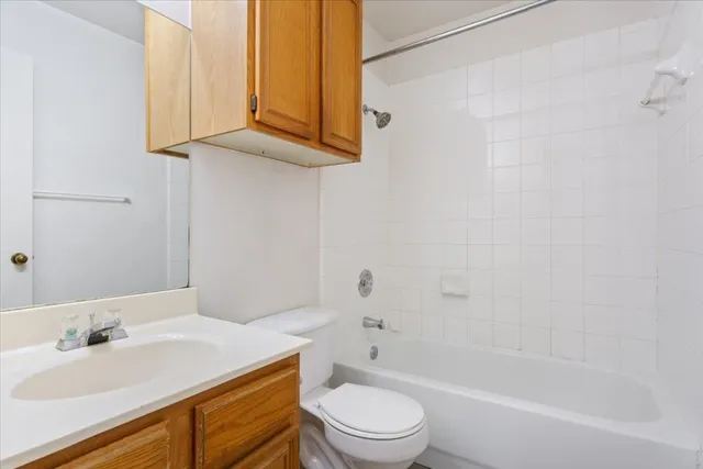 a bathroom with a sink a toilet and bathtub