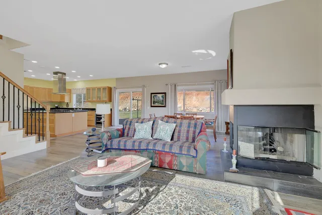 a living room with furniture window and a flat screen tv