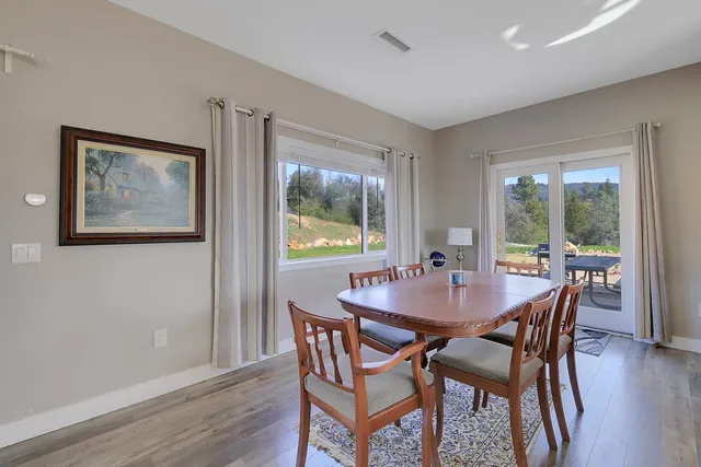 a large kitchen with granite countertop a large counter top stainless steel appliances and cabinets