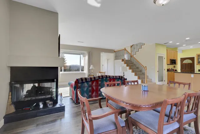 a kitchen with stainless steel appliances kitchen island granite countertop a stove and a refrigerator