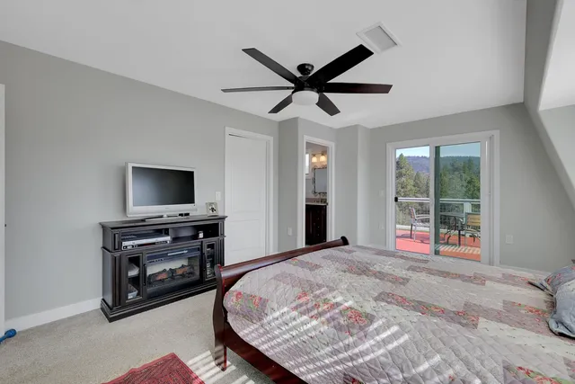 a view of a patio with a table and chairs