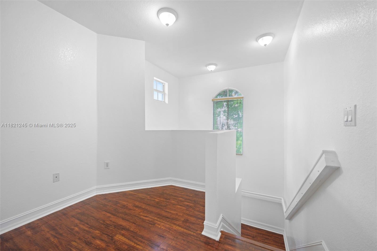7633 Northwest 114th Path, Unit 7633 Doral, FL 33178 - Photo 13 of 25 a view of entryway with wooden floor