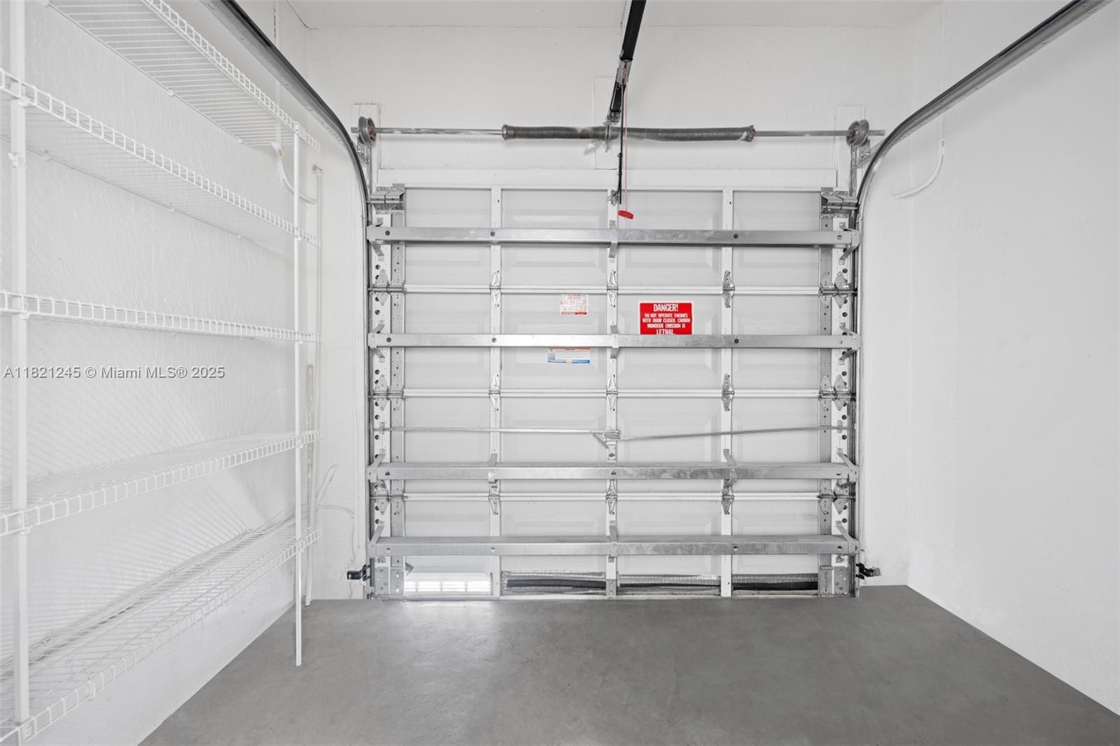 7633 Northwest 114th Path, Unit 7633 Doral, FL 33178 - Photo 20 of 25 a view of a room with racks on the wall