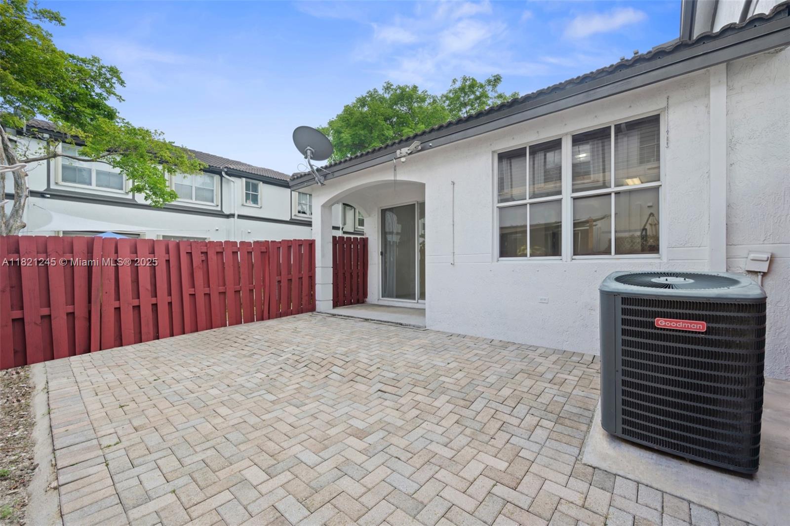 7633 Northwest 114th Path, Unit 7633 Doral, FL 33178 - Photo 23 of 25 a view of a house with a backyard