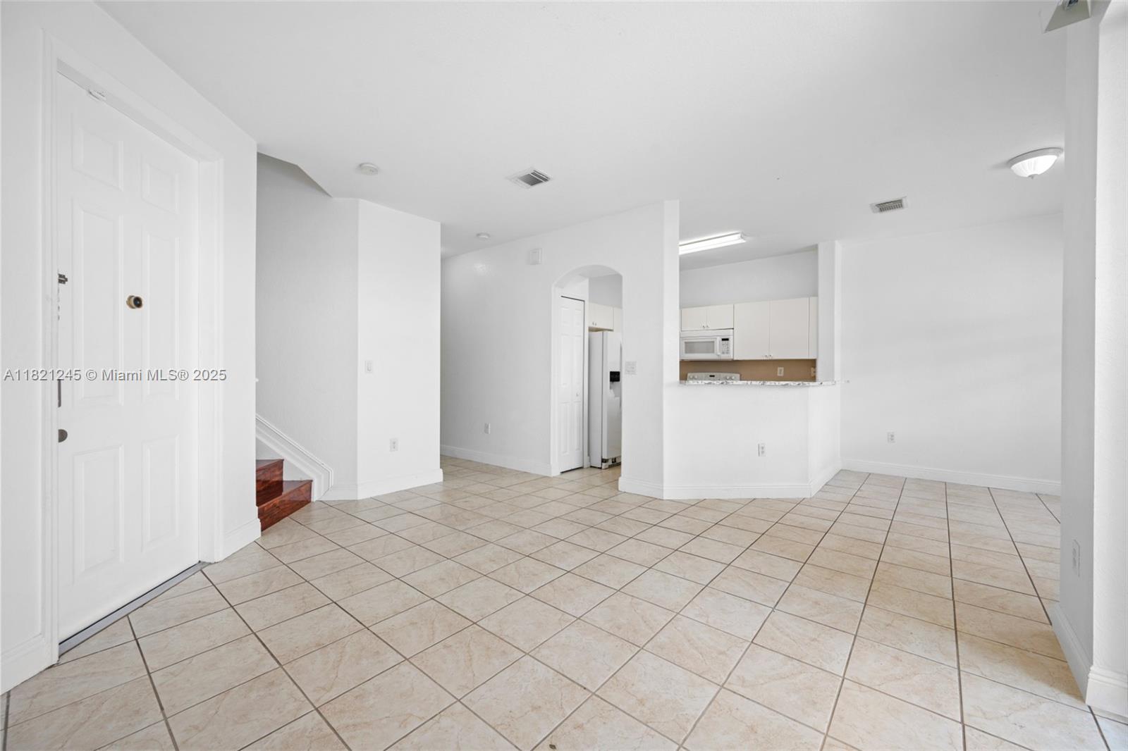7633 Northwest 114th Path, Unit 7633 Doral, FL 33178 - Photo 3 of 25 a view of an empty room and utility room