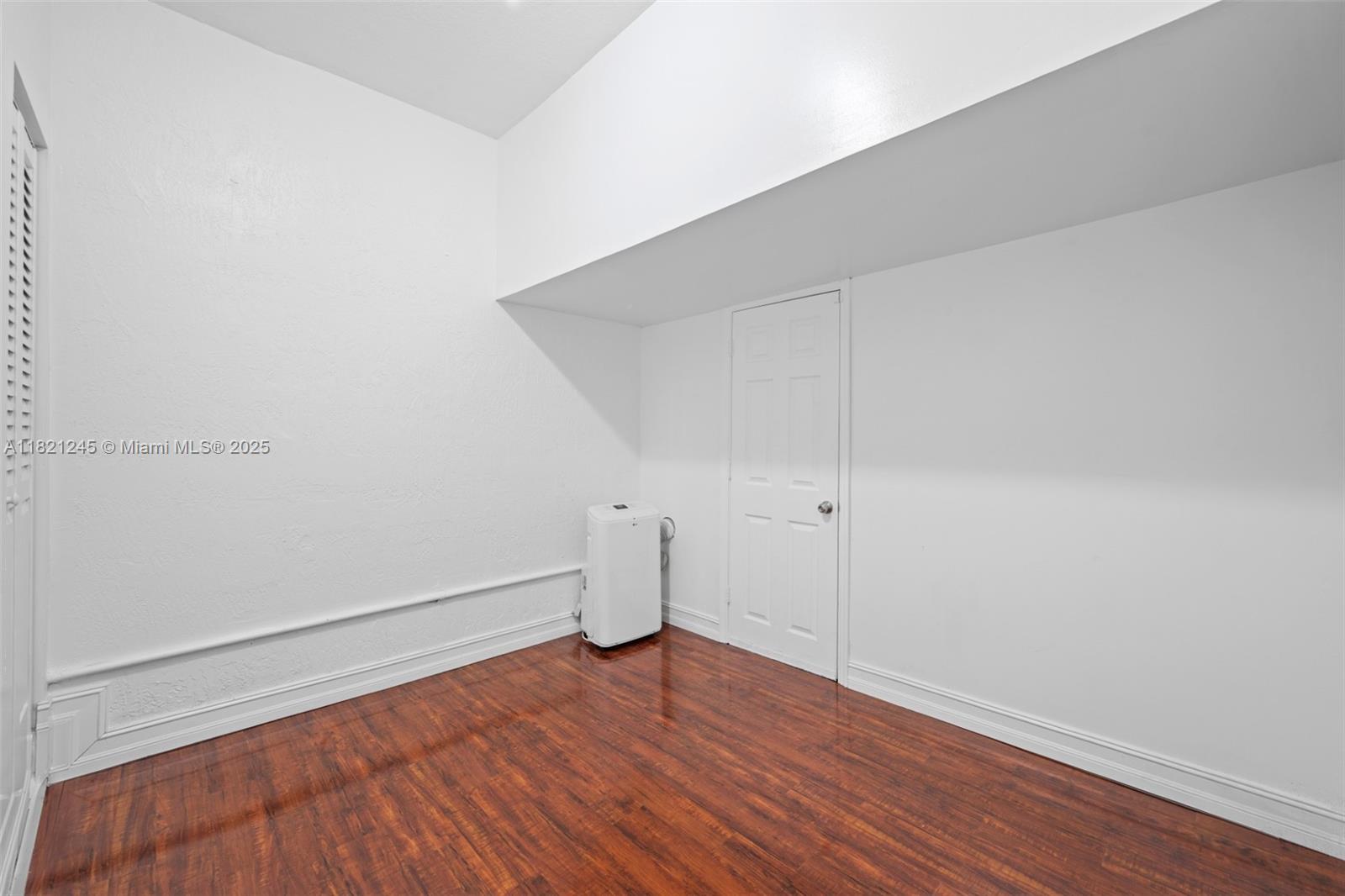 7633 Northwest 114th Path, Unit 7633 Doral, FL 33178 - Photo 6 of 25 a view of a room with wooden floor