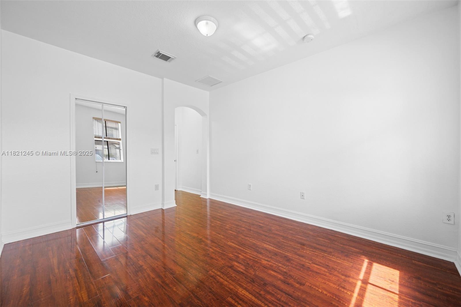 7633 Northwest 114th Path, Unit 7633 Doral, FL 33178 - Photo 9 of 25 wooden floor in an empty room