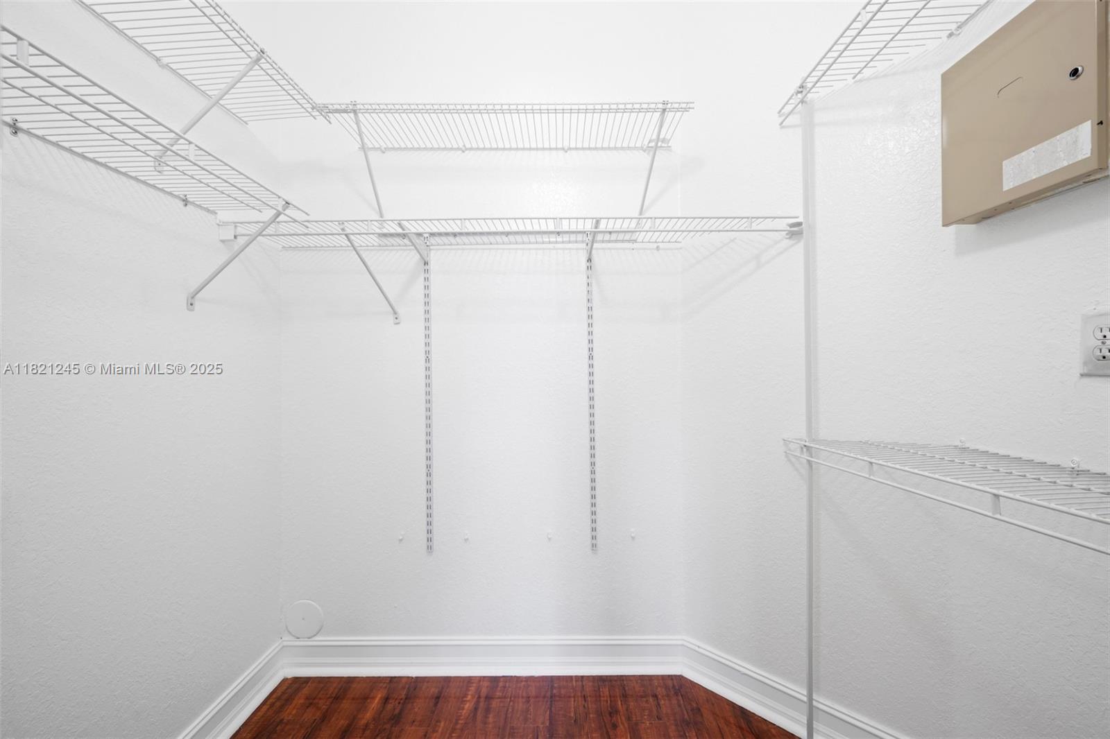 7633 Northwest 114th Path, Unit 7633 Doral, FL 33178 - Photo 10 of 25 a view of a room with racks on the wall