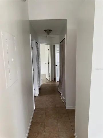 a white toilet sitting next to a bath tub