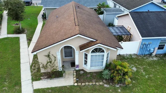 a aerial view of a house with a yard