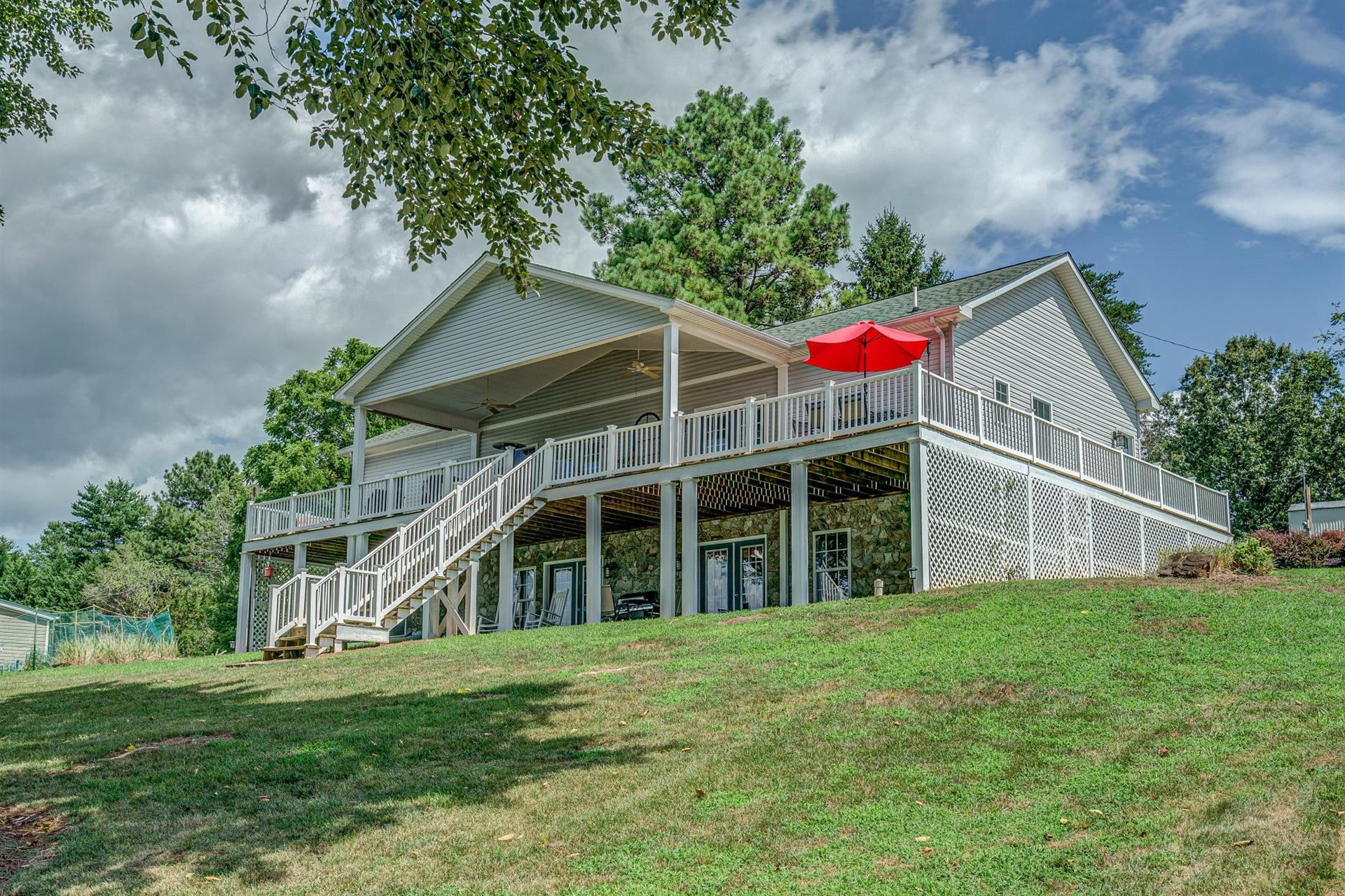 231 Spence Road Union Hall, VA 24176 - Photo 14 of 61 a view of a house with a yard and potted plants