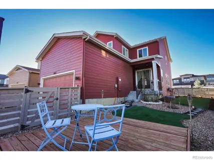 a view of an house with backyard space and garden