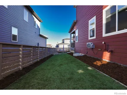 a view of an house with backyard space and garden