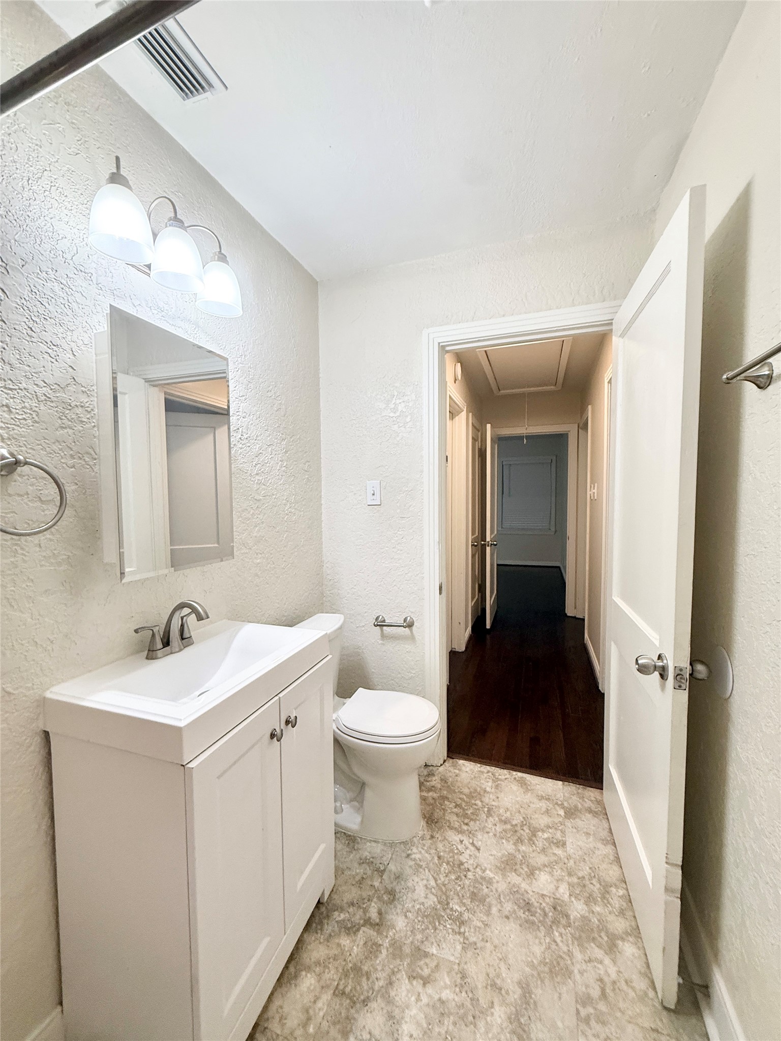 1232 San Felipe Street Angleton, TX 77515 - Photo 11 of 16 a bathroom with a sink a toilet and shower