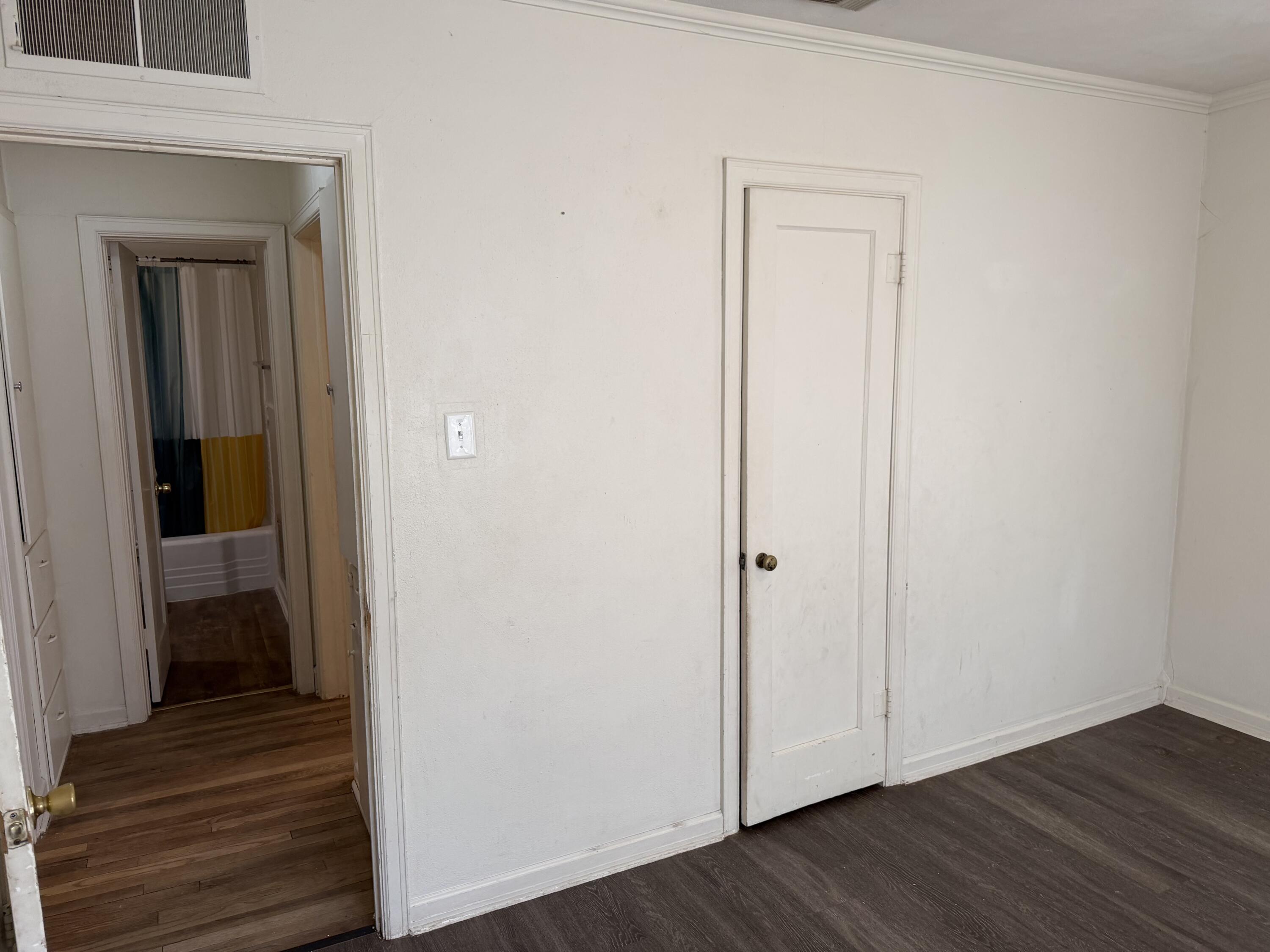 2612 36th Street Lubbock, TX 79413 - Photo 13 of 30 a view of a hallway with wooden floor