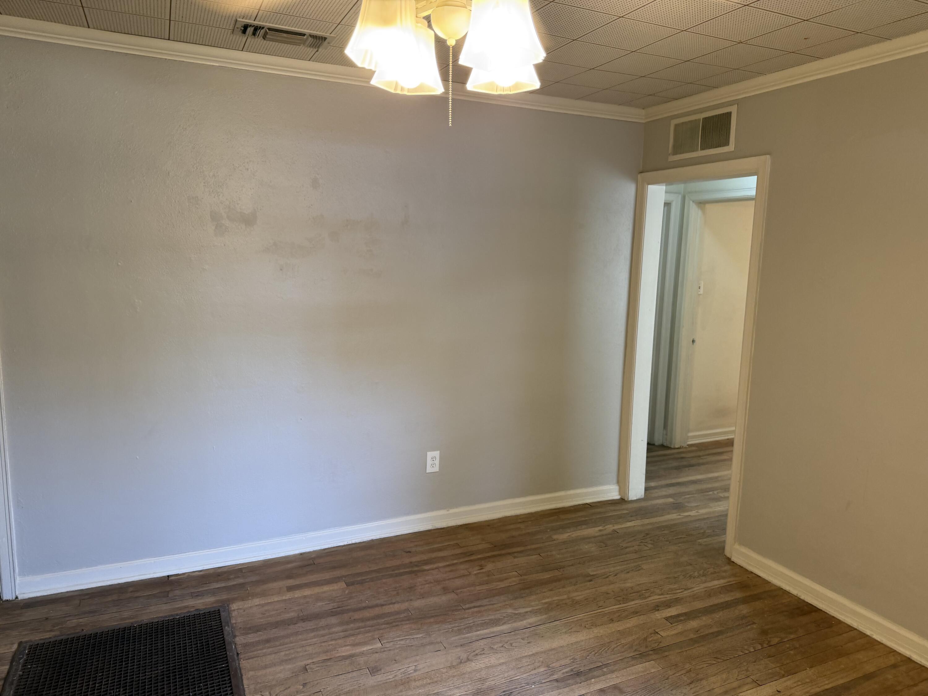 2612 36th Street Lubbock, TX 79413 - Photo 16 of 30 a view of a small space with wooden floor and a window