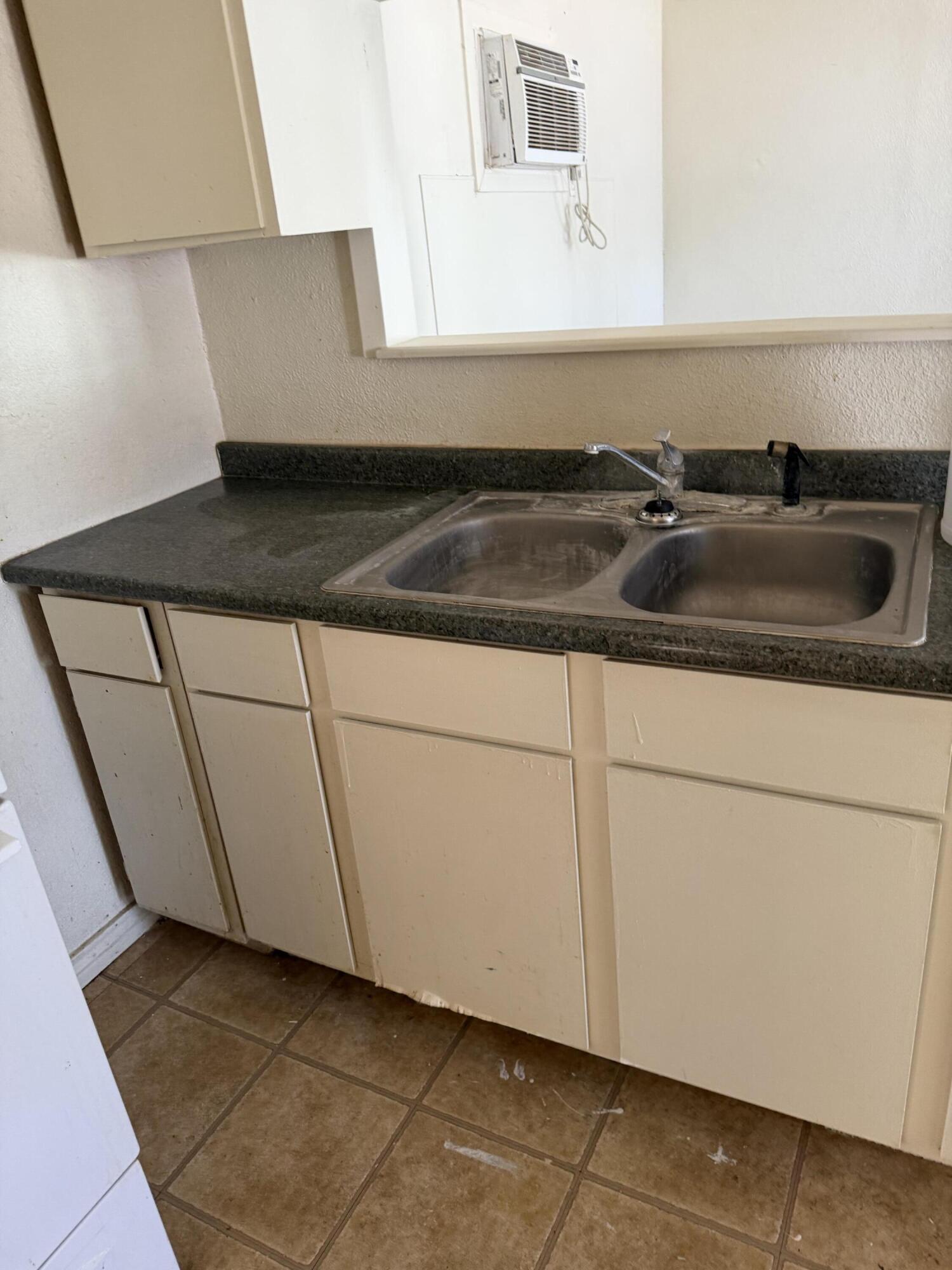 2612 36th Street Lubbock, TX 79413 - Photo 28 of 30 a kitchen with a sink and cabinets