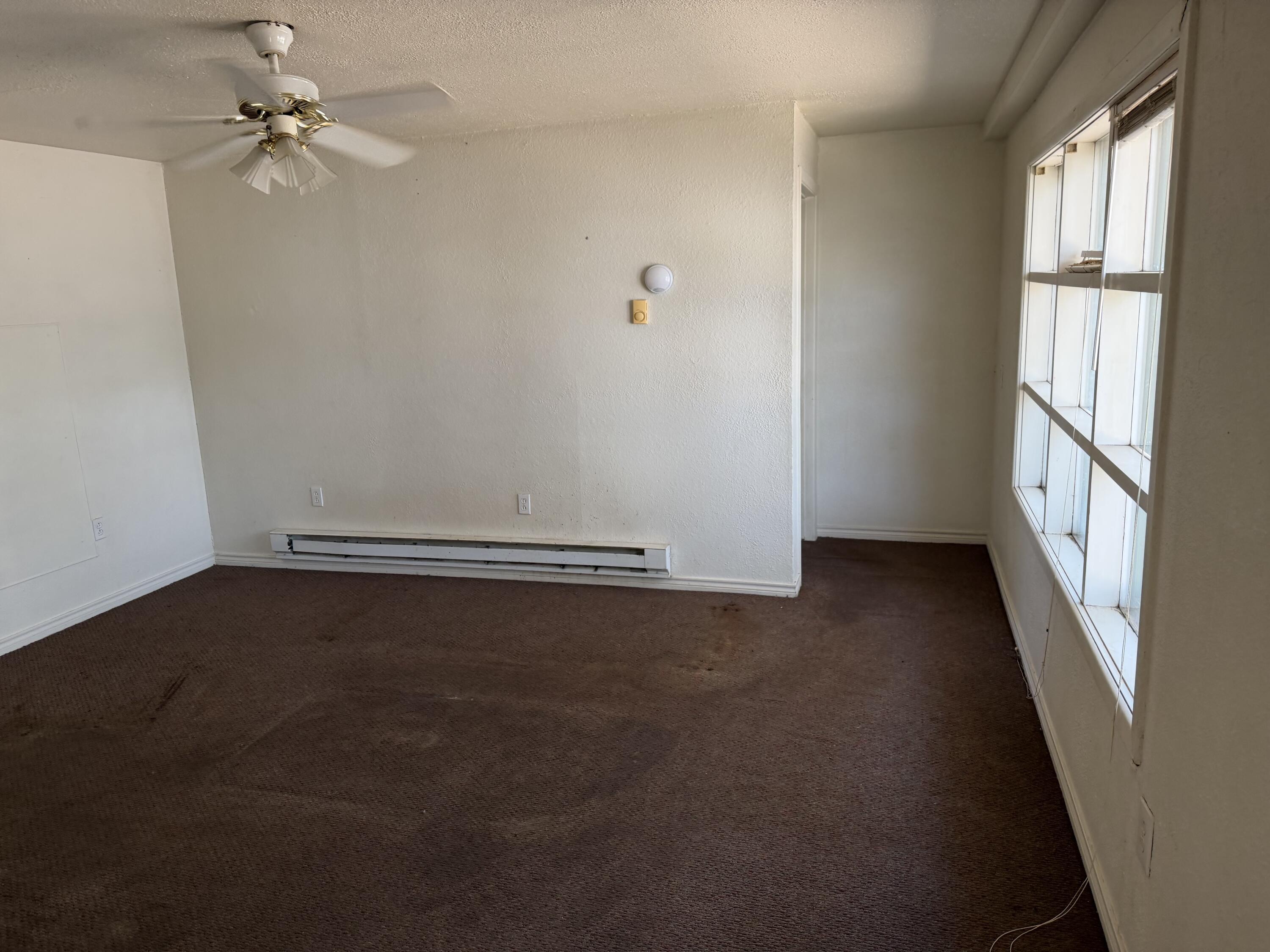 2612 36th Street Lubbock, TX 79413 - Photo 30 of 30 wooden floor in an empty room with a window