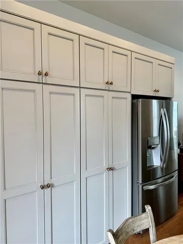 a bedroom with a bed and a mirror