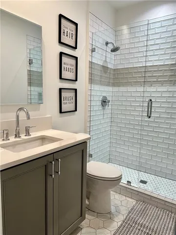 a bedroom with furniture and a rug