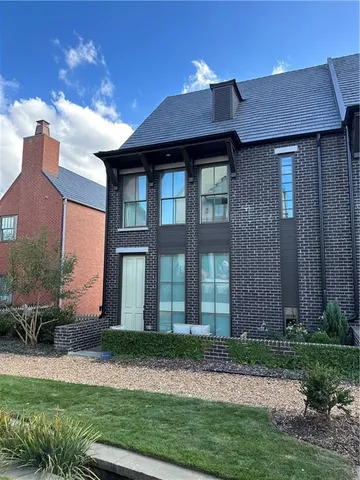 a view of house with backyard and garden