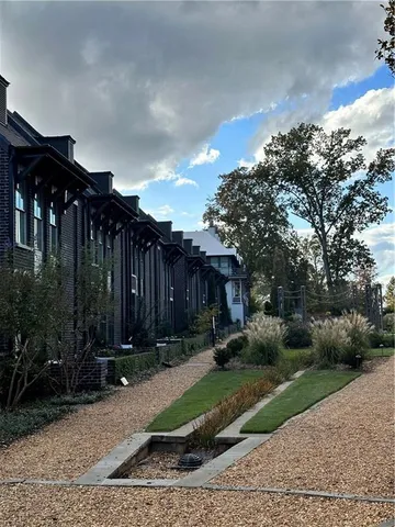 a view of a lake with houses in the back
