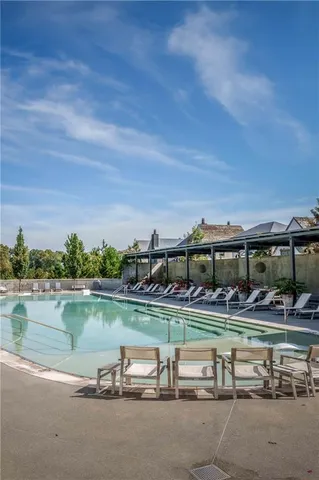 a view of a yard with wooden fence