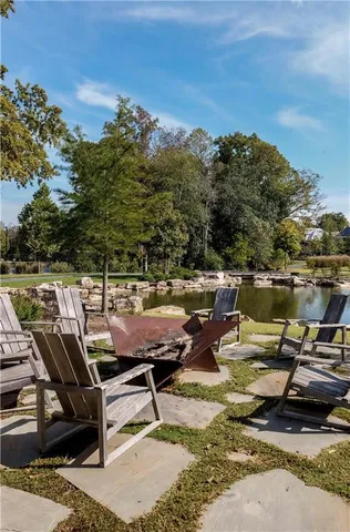 a view of a backyard with swimming pool