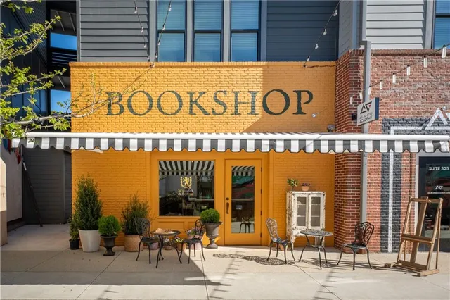 a front view of a building with retail shop and windows