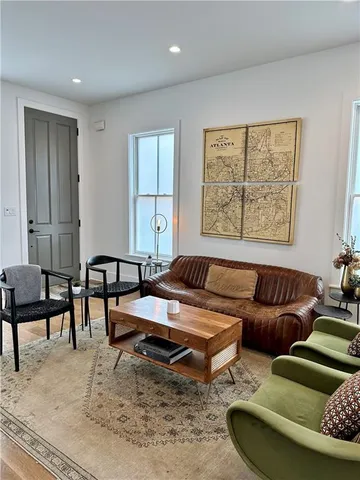 a living room with furniture and a large window
