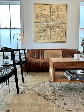 a living room with furniture and a gate