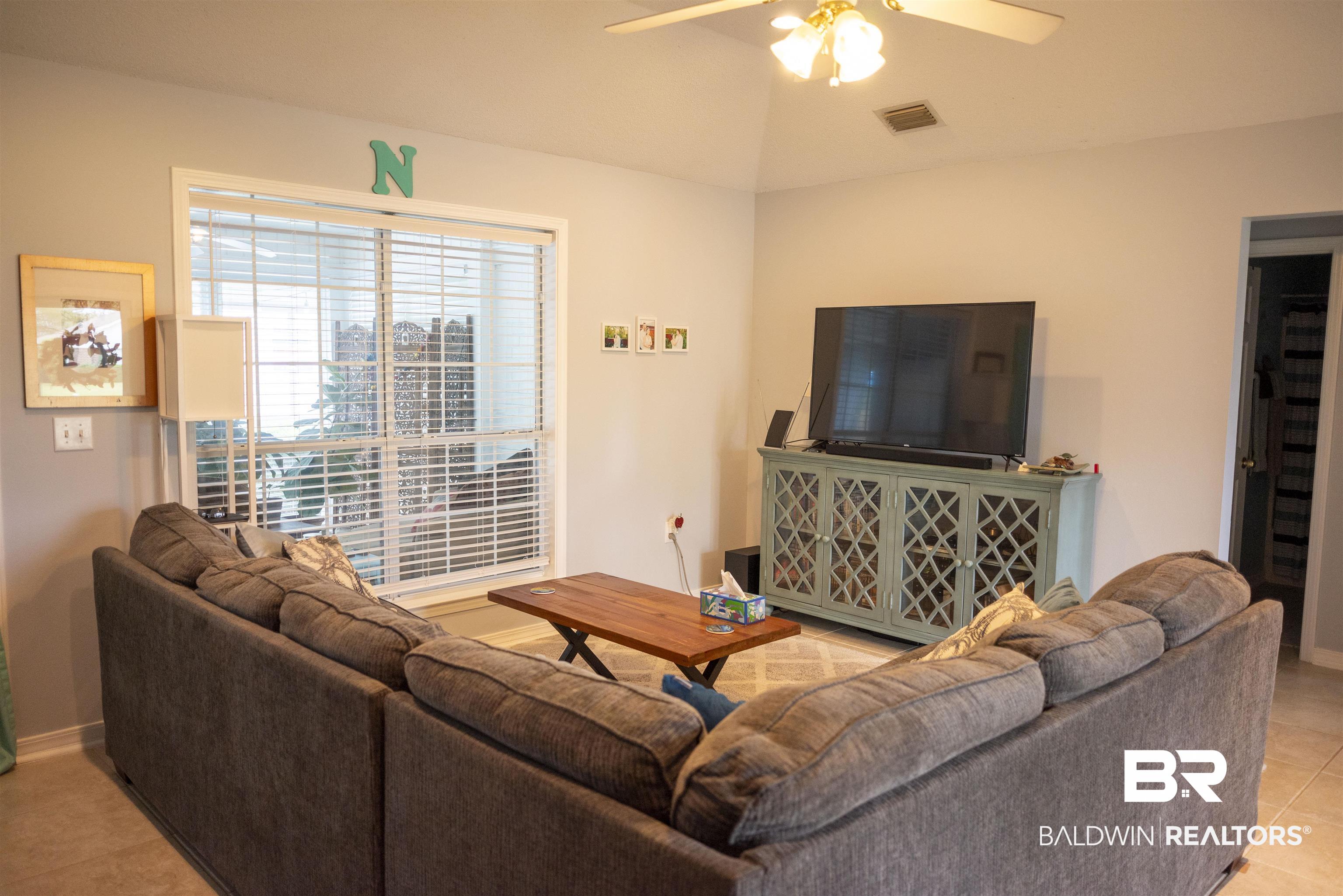 808 Wisteria Lane Foley, AL 36535 - Photo 3 of 19 Tiled living room with ceiling fan