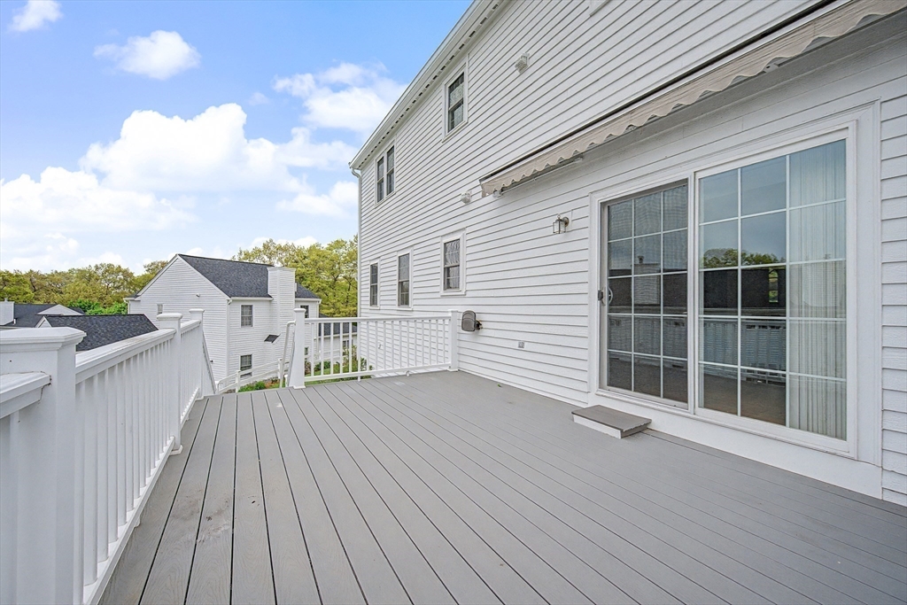 3 Oak View Terrace, Unit 3 Franklin, MA 02038 - Photo 30 of 38 a view of a deck with wooden floor and fence