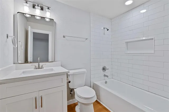 a bathroom with a sink a toilet and a bathtub