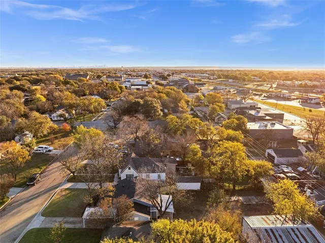 an aerial view of residential building and parking space