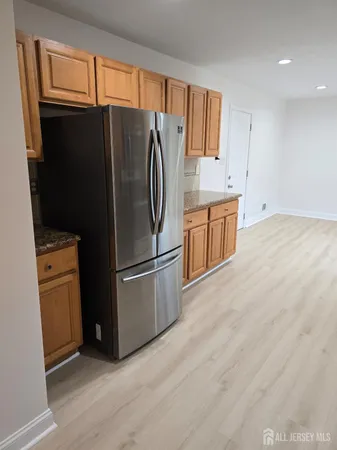 a kitchen with stainless steel appliances a refrigerator stove and sink