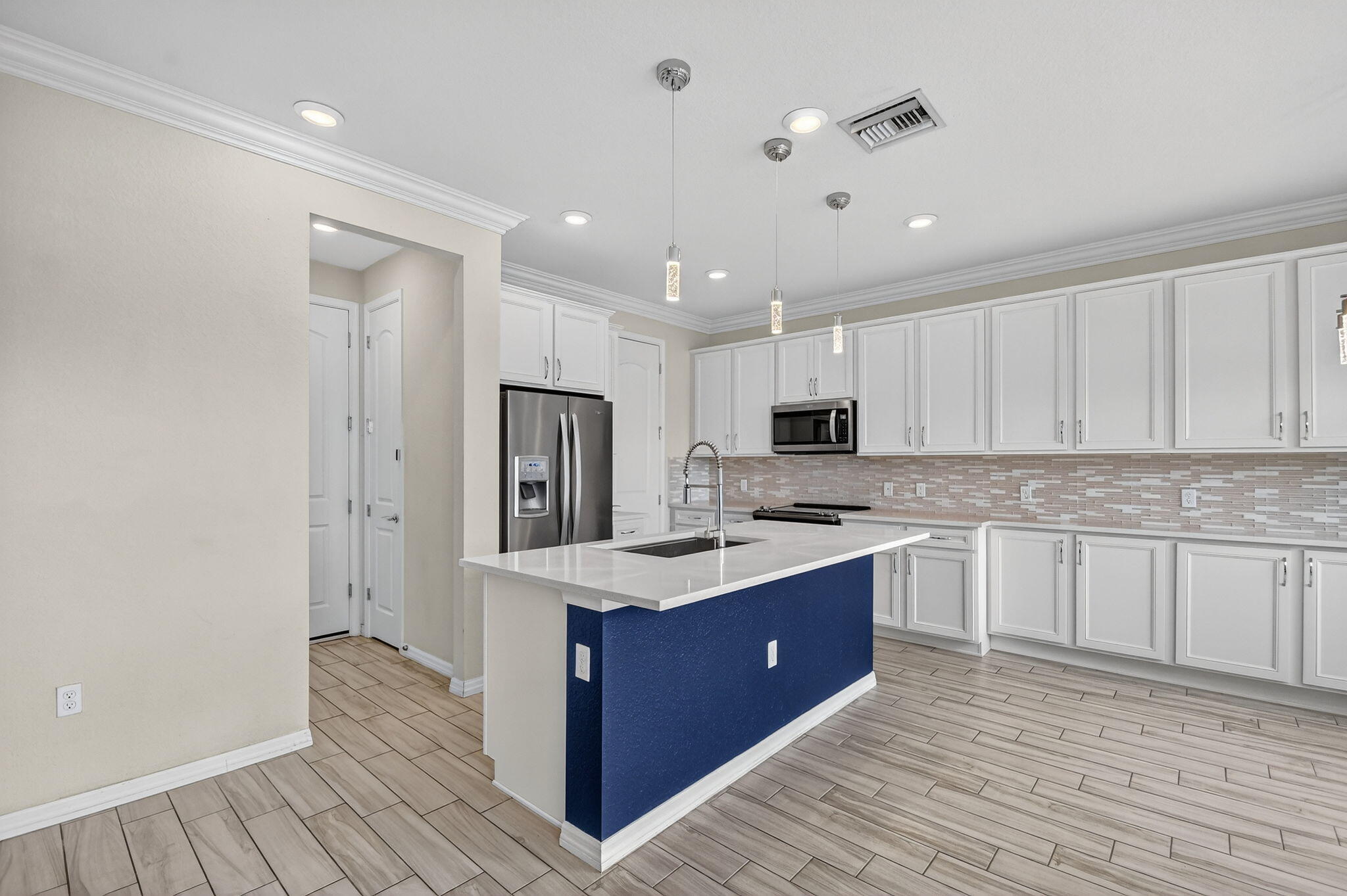 8301 Rearing Lane Lake Worth, FL 33467 - Photo 13 of 109 a kitchen with stainless steel appliances granite countertop a stove and a refrigerator