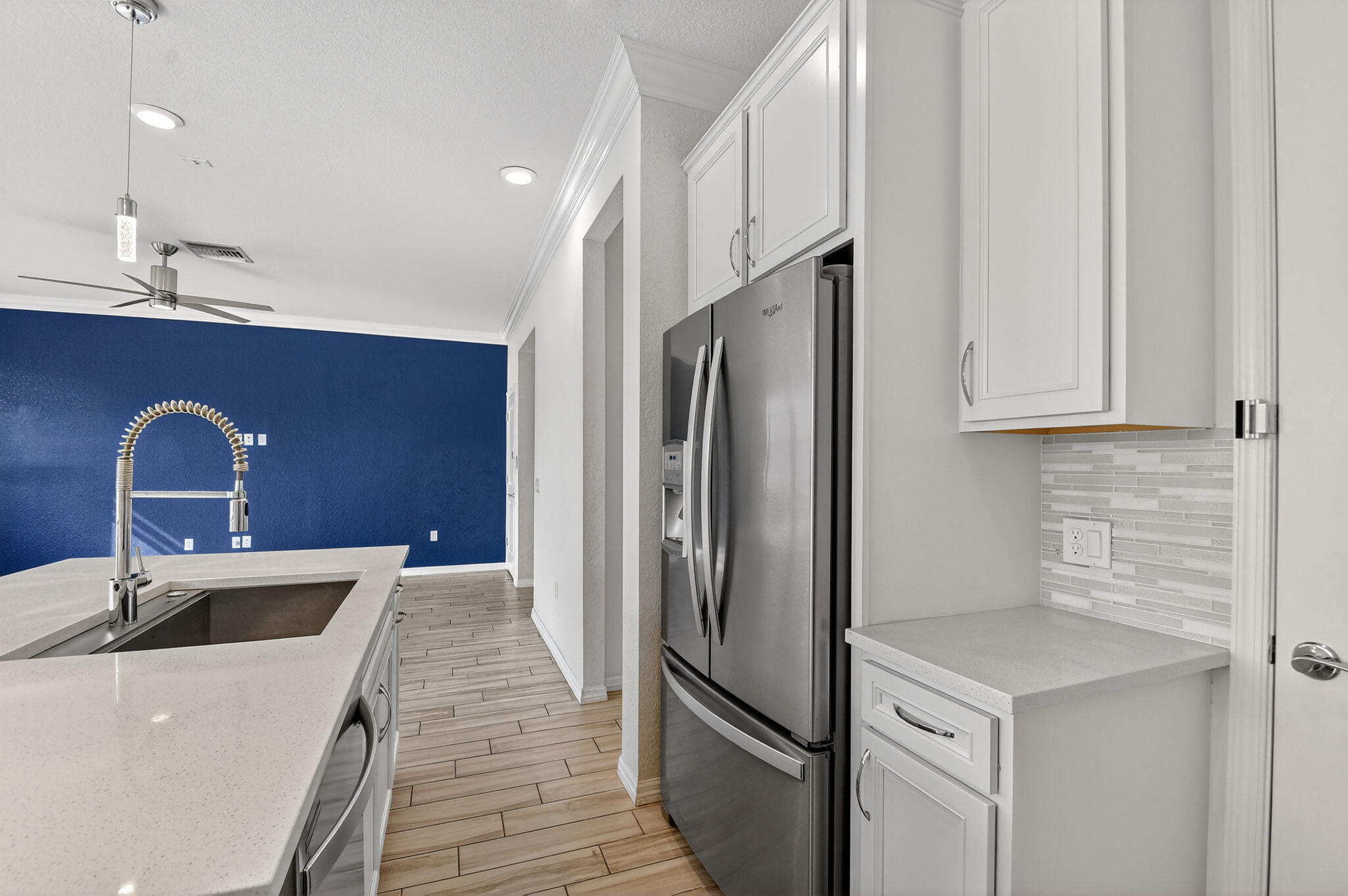 8301 Rearing Lane Lake Worth, FL 33467 - Photo 17 of 109 a kitchen with stainless steel appliances granite countertop a sink stove and refrigerator